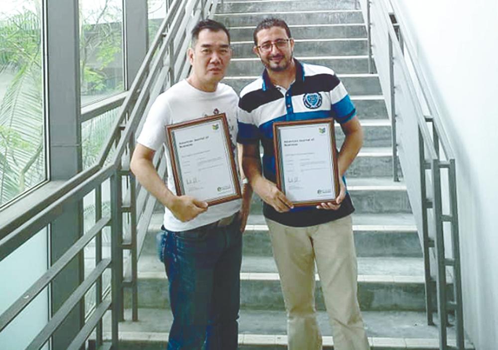 FBF academics Dr Tan Luen Peng (left) and Dr Abdelhak Senadjki displaying their certificate of “Highly Commended Paper” award in the 2019 Emerald Literati Awards, by Emerald Publishing.
