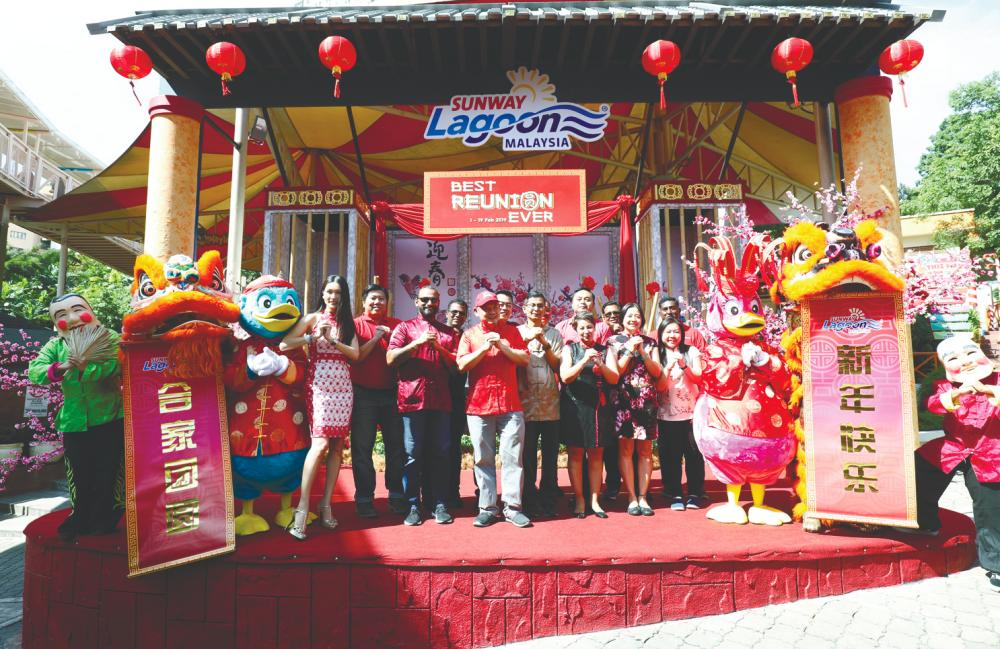 At the launch ... (clockwise, from top) Chia (far left) and Choo (with cap) with Sunway team wishing all Gong Xi Fa Cai– Asyraf Rasid/thesun