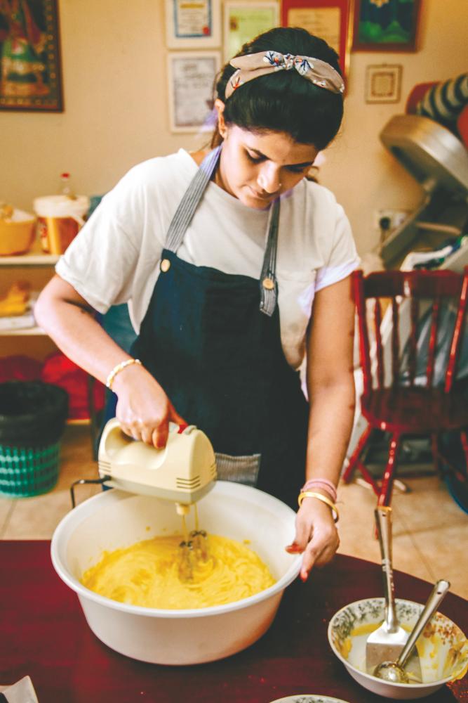 Hashviny shows how to make her eggless pineapple tarts. – KOGULAN AYAPPAN