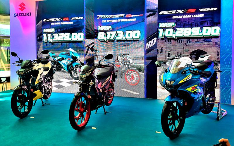 From left: The Suzuki GSX-S150, Raider 150 FI and GSX-R150. The prices displayed in the background are (from left) for the GSX-R150, Raider 150FI and GSX-S150, respectively.
