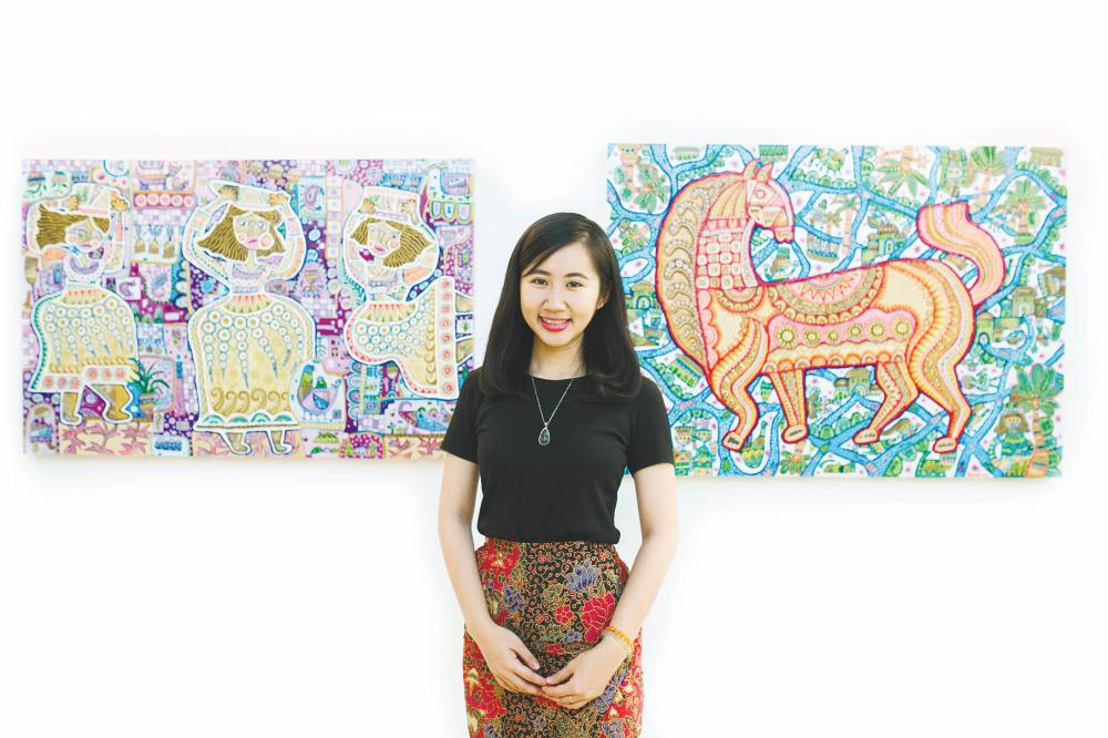 Koo with her artworks. – Courtesy of Yeanni Koo