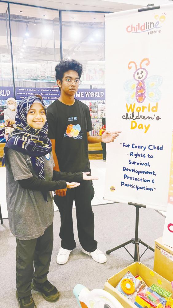 $!(From left) Ilham Humaira, from the PJ Child Council and Sean Zachariah. Both firmly believe in the UNCRC. DHARSHINI GANESON/THESUN