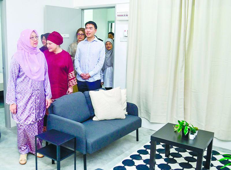 Zaliha (left) visits one of the Residensi Kecapi low-cost housing units. – ADAM AMIR HAMZAH/THESUN
