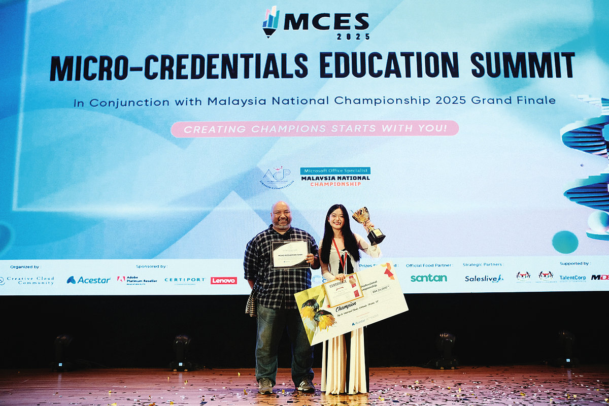 Wong with teacher-mentor Rizzham, after winning the Adobe Certified Professional (ACP) Malaysia National Championship 2025.