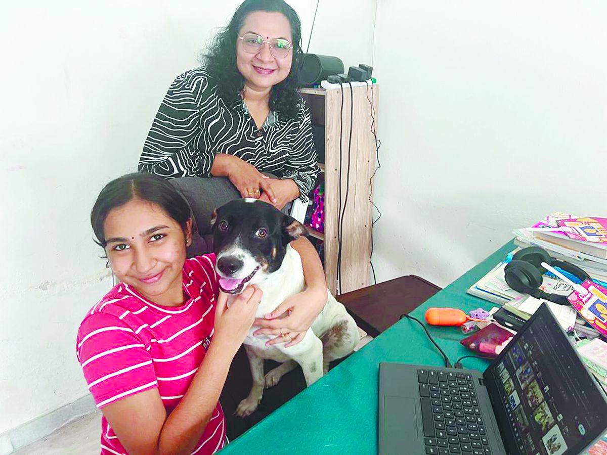 Thaynhiskha enjoys her digital classes, seen here at home with mother Deepa, where she rests in between her lessons.