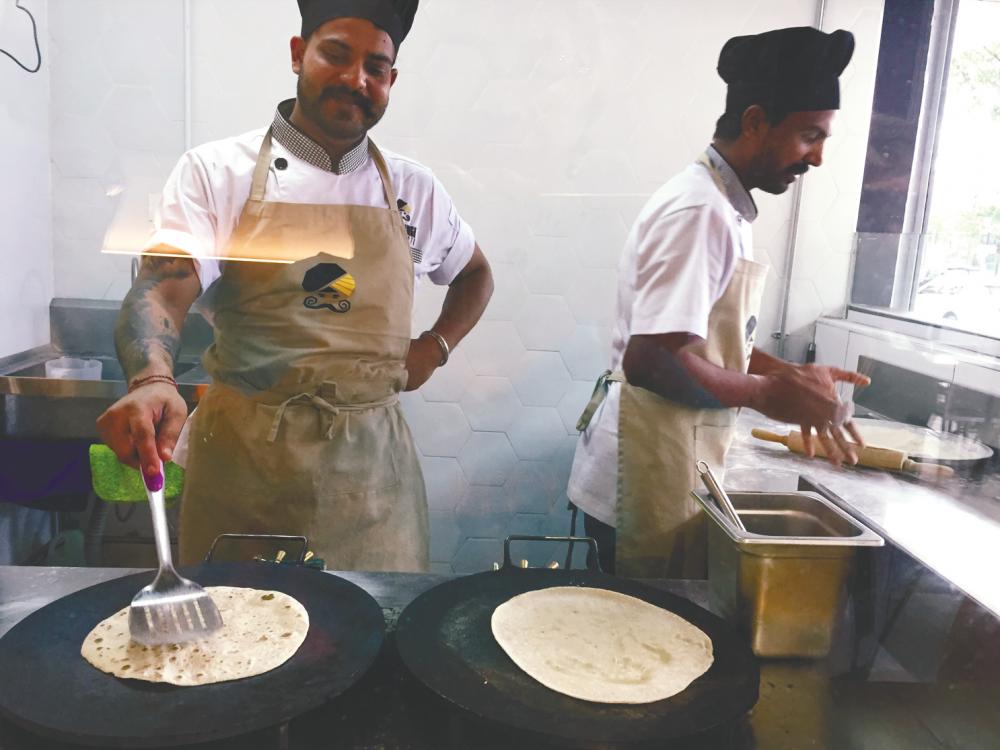 The roti kitchen in the front. – PICTURES BY TAN BEE HONG