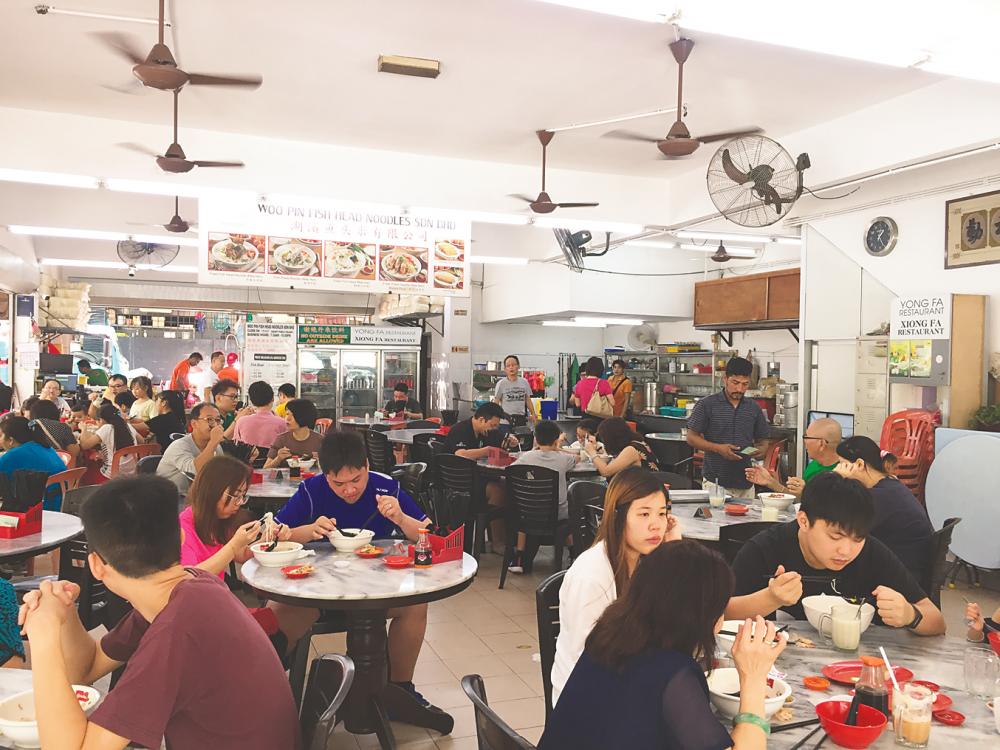 Woo Pin is packed with customers eager to try the simple, homemade dishes here. – TAN BEE HONG