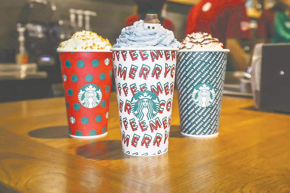 (from left) Toffee Nut Crunch Latte, Holiday French Vanilla Latte and Peppermint Mocha. – ADIB RAWI YAHYA/THESUN