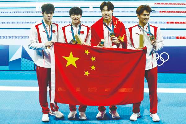 China’s Gold medallists after winning the men’s 4x100m swimming medley relay. – Reuterspic