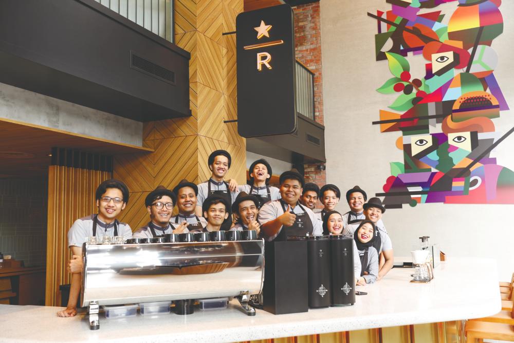 Staff are all smiles at the newly opened Starbucks Reserve Bukit Bintang Junction. – STARBUCKS MALAYSIA