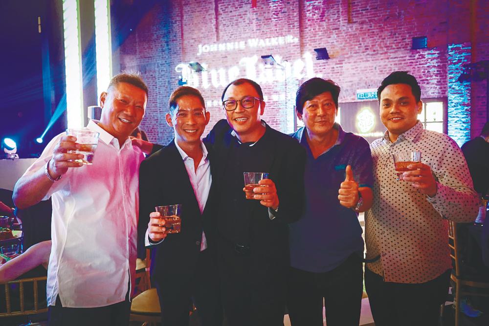 At the launch ... Diageo Malaysia brand ambassador Jeremy Lee (second from left) and Moet Hennessy Diageo Malaysia senior sales manager Jesse Lim (centre) along with party guests.
