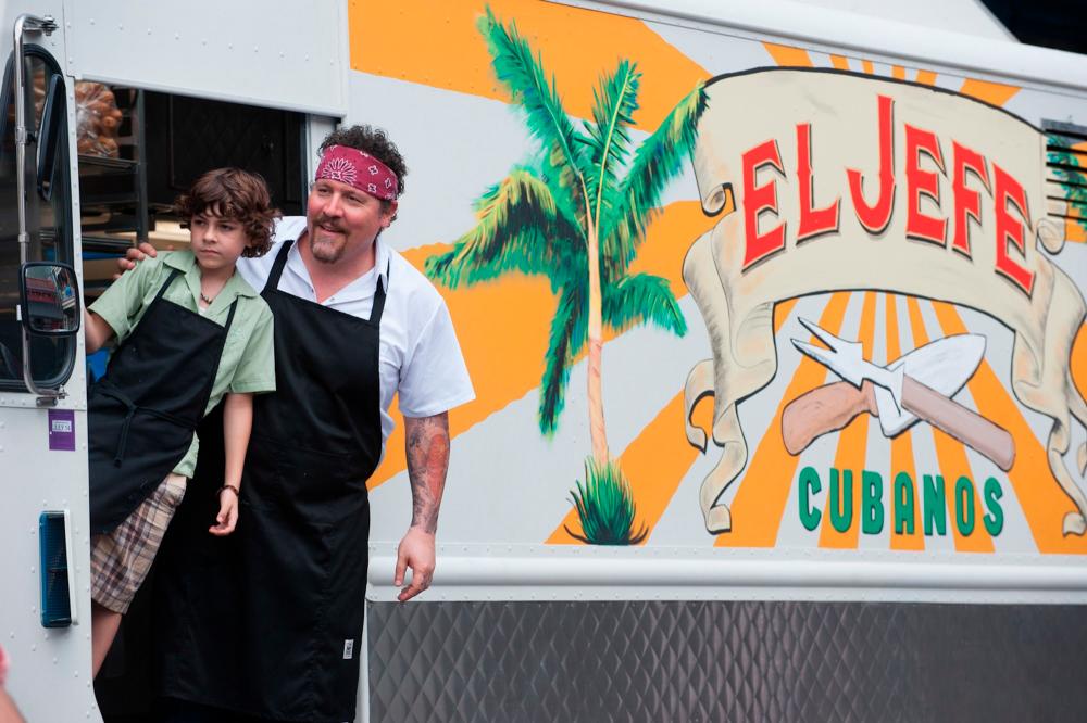 $!(right) The real star of Chef is the “El Jefe” food truck and the scrumptious food it serves on its cross-country journey.