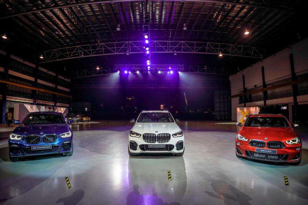 From left: The second-generation BMW X4, fourth-generation BMW X5, and BMW X2 M35i, during the preview at the former Royal Malaysian Police Air Wing Unit aircraft hangar in Sungai Besi, Kuala Lumpur.