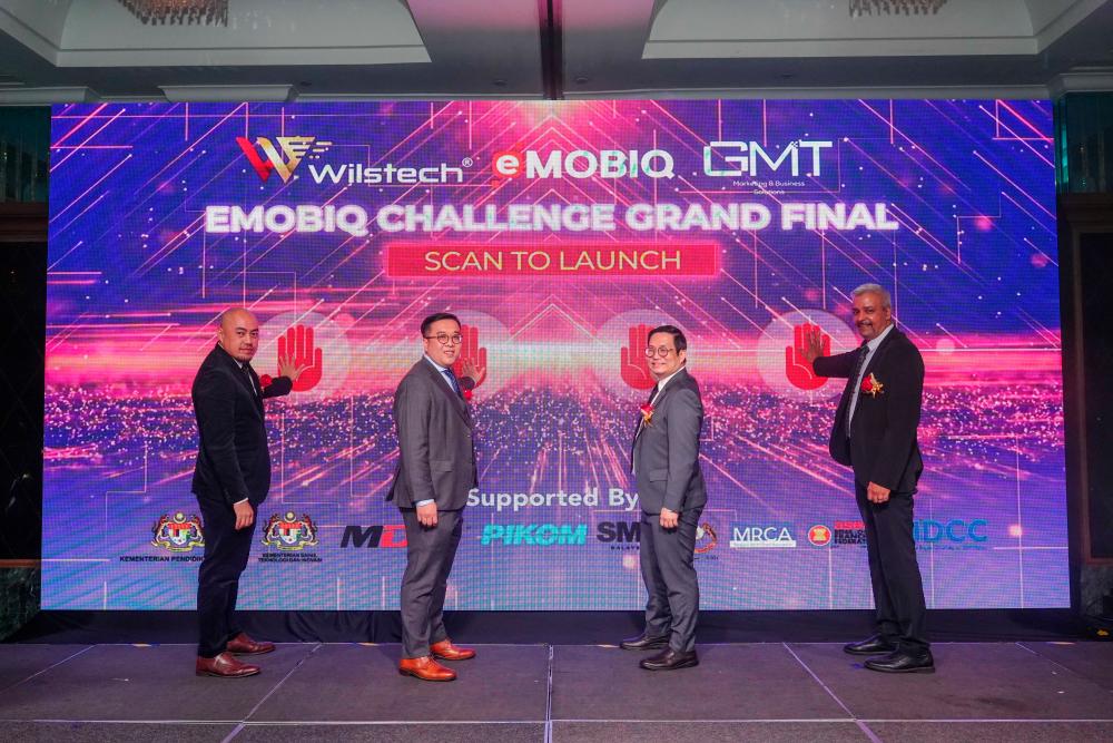 From left: GMT CEO CT Shum, Low, Wilstech COO Ernie Tan and OrangeKloud vice-president Muhammad Shaamel, at the launch.