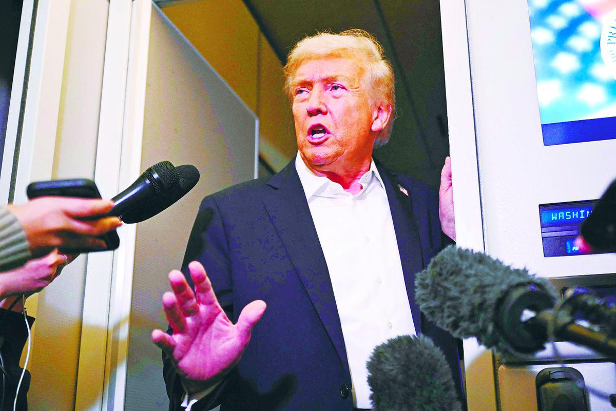 Trump speaks with the press on board Air Force One in Mildenhall, Suffolk yesterday after he and regional leaders signed a declaration to cement a ceasefire in Gaza. – AFPPIX