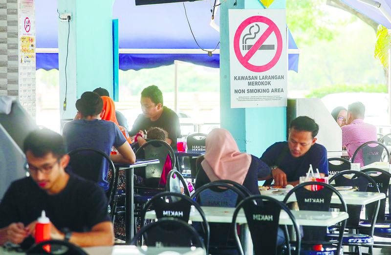 Jawahar said although some customers support the smoking ban in eateries, others have threatened to harm workers who confront them. – Adib Rawi Yahya/theSun