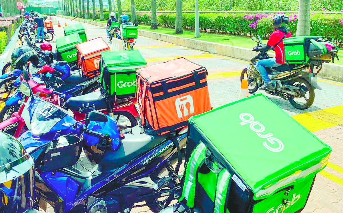Muhammad Zahid said some of the younger staff under his watch take on Grab jobs after work just to get by. – Amirul Syafiq/theSun