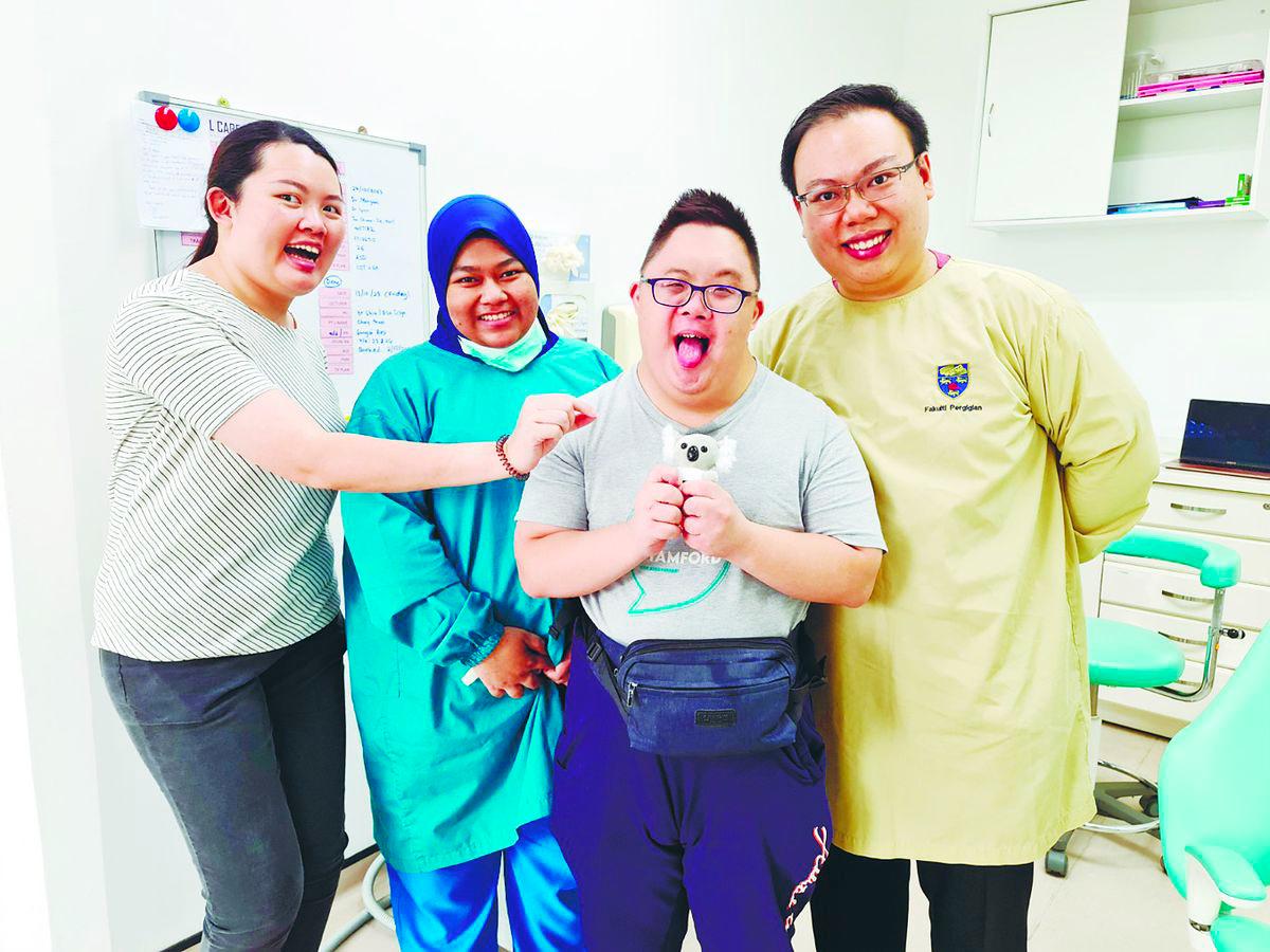 Dr Lynn (first left) ensures all her patients, whether wheelchair-bound or those with learning disabilities feel comfortable.