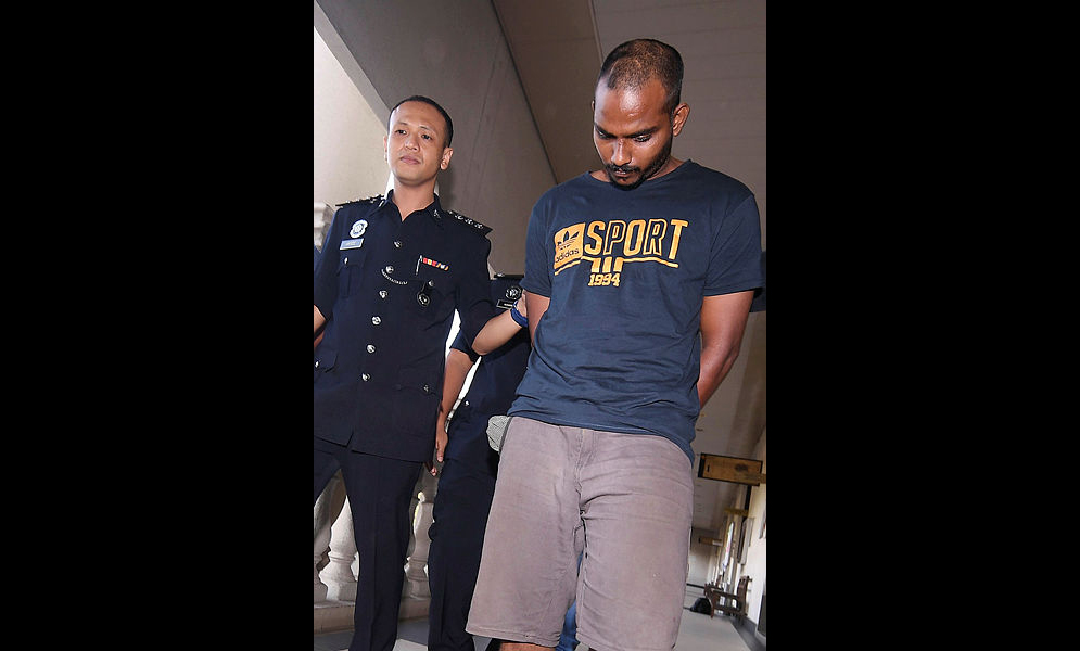G. Tinathayaalan, 26, an air-conditioning servicemen (R) was charged in the Kuala Lumpur sessions court on March 1, 2019, for committing an assault and robbing a woman inside an MRT station lift in Cheras two weeks ago. — Bernama