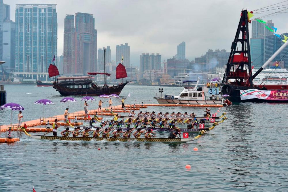 $!The juxtaposition of traditional dragon boats gliding through the water against the backdrop of Hong Kong’s modern cityscape creates an awe-inspiring moment. (Photo Credit: Hong Kong Tourism Board)