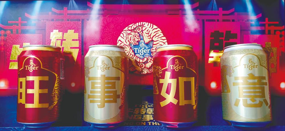 Limited edition Tiger Beer and Tiger Crystal CNY cans on stage.