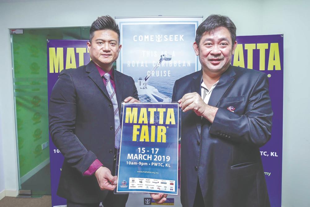 Matta exco member of cruises, Kenny Cheong (R) with Royal Caribbean Cruises head of Asia Pacific sales Josh Wan (L) during a press conference in Kuala Lumpur on March 7, 2019. — Sunpix by Adib Rawi Yahya