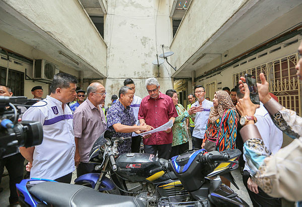 The Federal Territories Minister, Khalid Abdul Samad visits the residents’ block of the Taman Segar Apartment at the ceremony of the Segar Residences Handover Ceremony today. — Amirul Syafiq Mohd Din