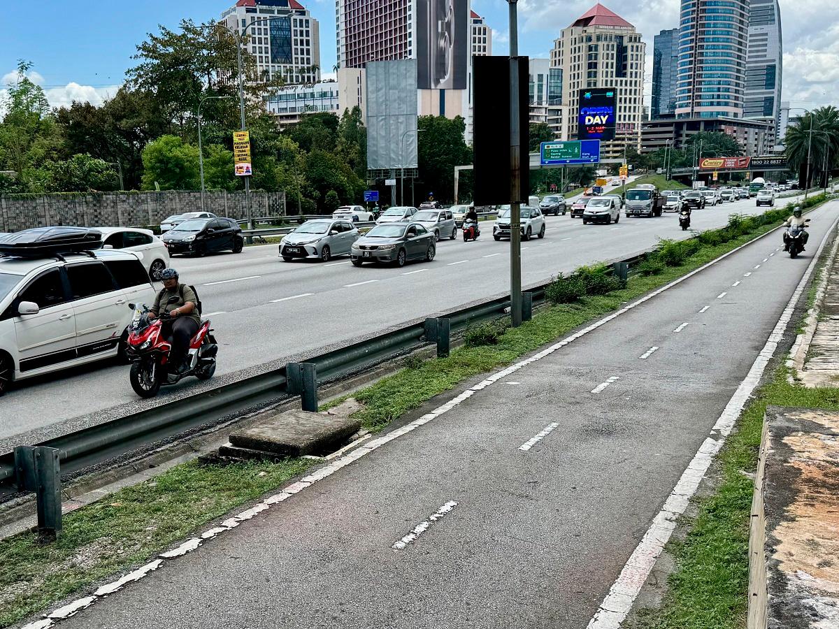 Although motorcyclists risk being fined for riding on major roads, many believe it is the lesser of two evils compared with the dangers of motorcycle lanes. – ADAM AMIR HAMZAH/THESUN