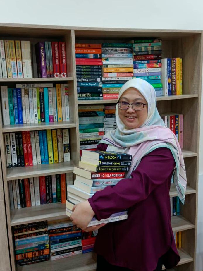 Noreen with some of the books she has for sale. – Wan Noreen Wan Ahmad