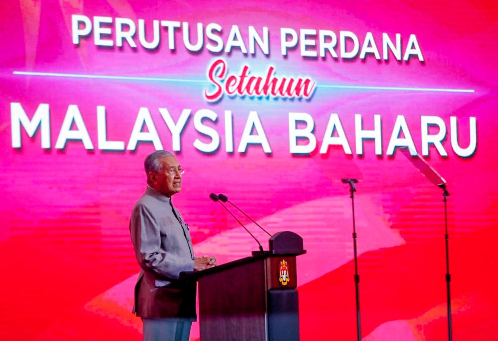 Prime Minister Tun Dr Mahathir Mohamad delivering his premier address in conjunction with the first anniversary of PH rule at the Putrajaya International Convention Centre (PICC) in Putrajaya on May 9, 2019. — Sunpix by Ashraf Shamsul