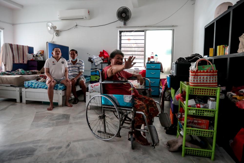 $!At the Shan Ai Handicapped Welfare Home in Cheras, Selangor, residents relax amid clean and comfortable surroundings at the home. – ASHRAF SHAMSUL/THESUN