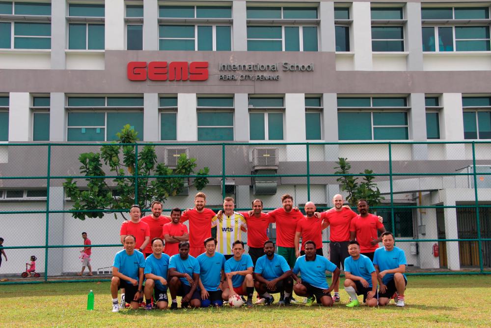 Parents played against teachers in a game of charity football.
