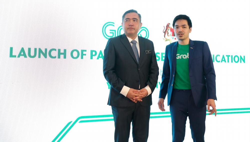 Malaysian Transport Minister Anthony Loke (L) and Grab Malaysia country head Sean Ooi during the launch of Grabs latest selfie verification feature at the Grab HQ in First Avenue, Petaling Jaya on April 11, 2019. — Sunpix by Norman Hiu