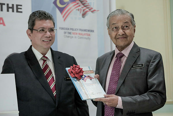Prime Minister Tun Mahathir Mohamad together with Minister of Foreign Affairs, Datuk Saifuddin Abdullah during the launch of the Foreign Policy Framework of the New Malaysia at Perdana Putra today. — Sunpix by Ashraf Shamsul