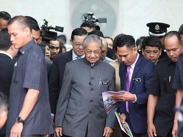 Prime Minister Tun Dr Mahathir Mohamad leaves after speaking to members of the press after the National Strategy for Financial Literacy launch event at the Sasana Kijang, Kuala Lumpur on July 23. — Sunpix by Norman Hiu