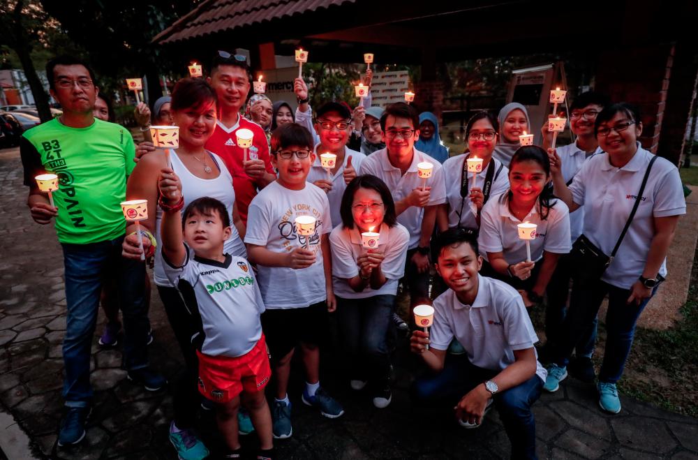 Mercy Malaysia organises a candlelight night walk event at Bukit Kiara, Kuala Lumpur on Dec 15 2018. — Sunpix by Ashraf Shamsul