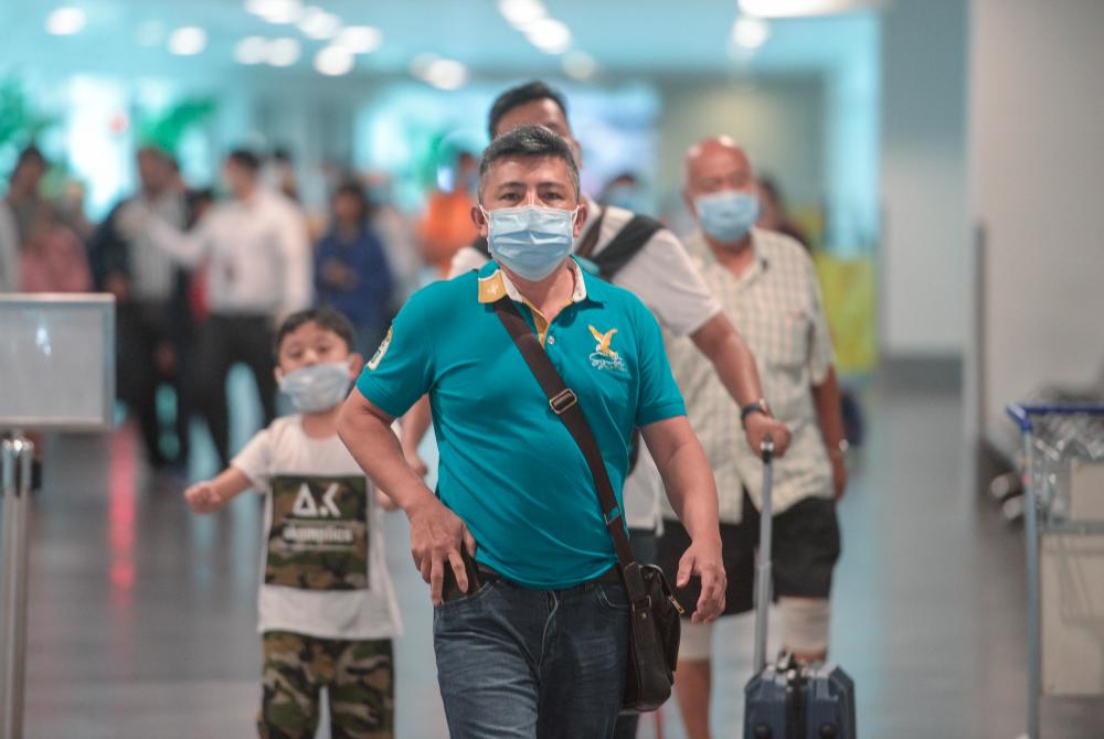 A group of tourists believed to be from China used mouthwash and nose masks to prevent 2019 Novel Coronavirus (2019-nCoV) infections during surveys at the Kuala Lumpur International Airport (KLIA) and KLIA2 on Jan 29. — Sunpix by Amirul Syafiq Mohd Din