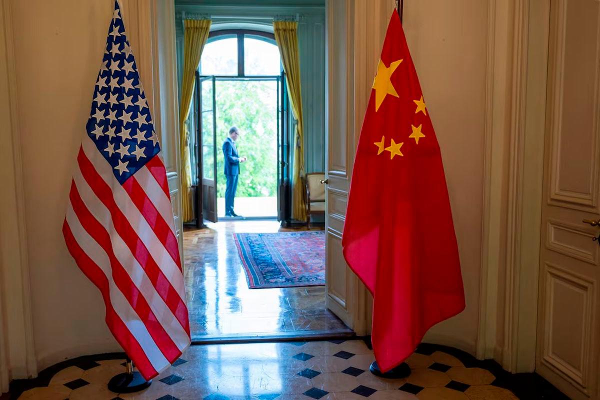 The U.S. and Chinese flags are seen on the day of a bilateral meeting between the U.S. and China, in Geneva, Switzerland, May 10, 2025. KEYSTONE/EDA/Martial Trezzini/Handout via REUTERS/File photo