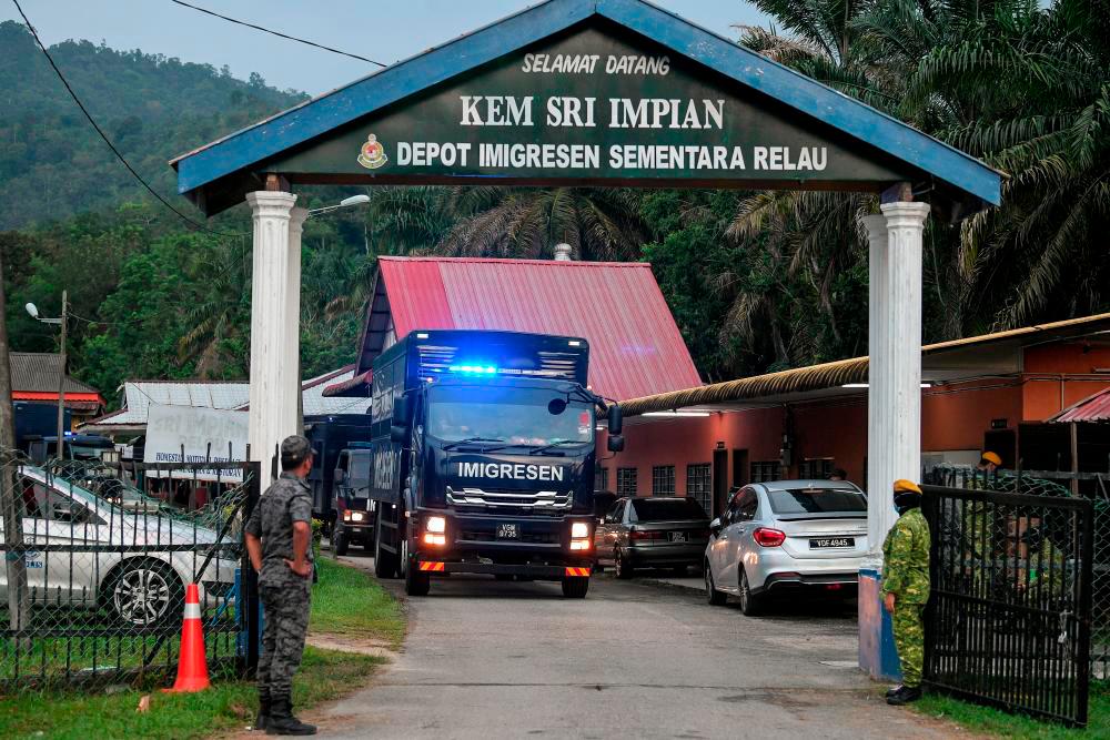 Several Malaysian Immigration Department lorries carrying some Rohingya ethnic detainees were seen leaving the Relau Bandar Baharu Temporary Immigration Depot believed to be transferred to another detention depot. BERNAMApix