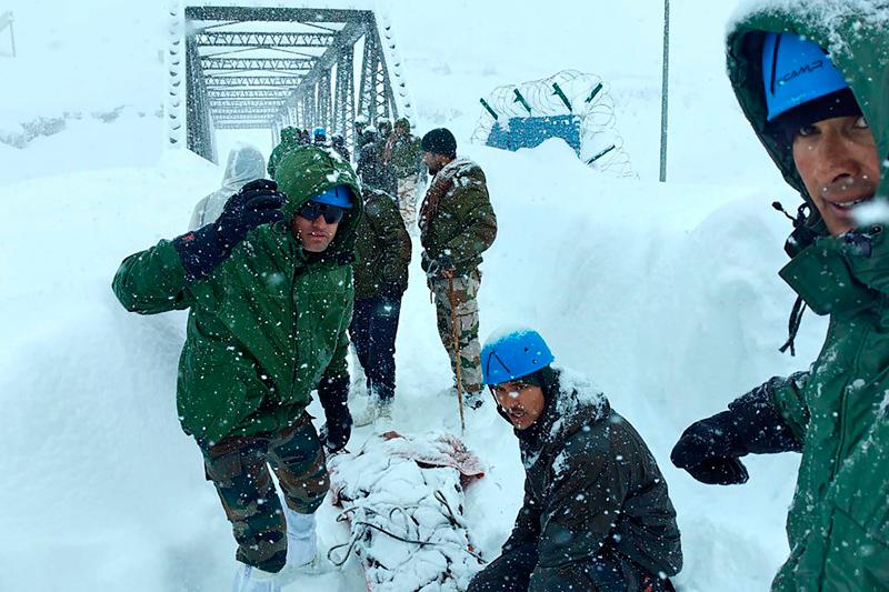 In this handout photograph taken and released by the Department of Information and Public Relations (DIPR) Uttarakhand on February 28, 2025, rescuers carry out an operation after Border Roads Organisation (BRO) workers got trapped under an avalanche near Mana village in Chamoli district of India's Uttarakhand state. Search teams in northern India on March 1 attempted to rescue 22 workers believed to be trapped after an avalanche hit a remote border area, officials and local media said. - DEPARTMENT OF INFORMATION AND PUBLIC RELATION (DIPR) UTTARAKHAND / AFP