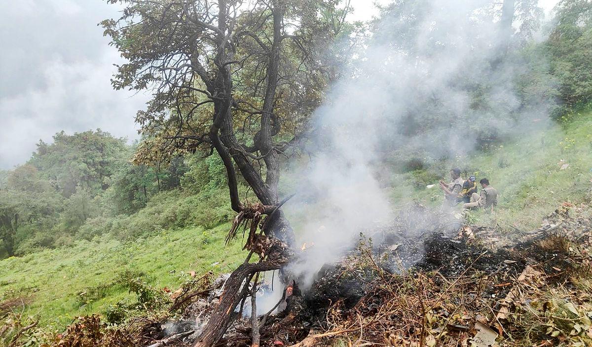 This handout photograph taken on June 15, 2025 and released by the State Disaster Response Force (SDRF) of India’s Uttarakhand state shows smoke billowing from the site of a chopper crash near Gaurikund. Seven people including a toddler were killed on June 15, in India when a helicopter ferrying Hindu pilgrims back from a shrine crashed in the Himalayas, officials said. AFPpix