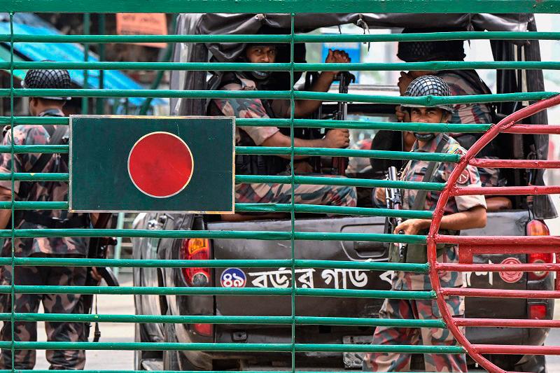 Border Guard Bangladesh (BGB) personnel stand guard at the India-Bangladesh border of Petrapole about 100km north-east of Kolkata - AFPpix