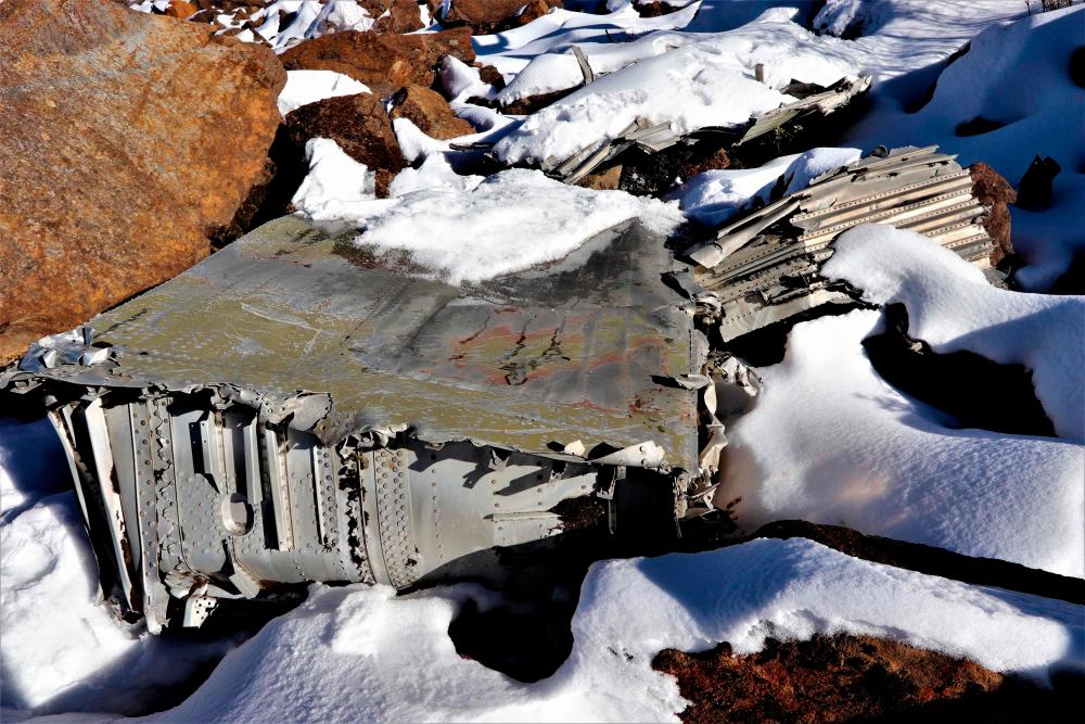 January 20, 2022 by MIA recoveries shows the wreckage of World War II C-46 aircraft on a snow-covered mountain side in the northeastern state of Arunachal Pradesh in India. AFPPIX