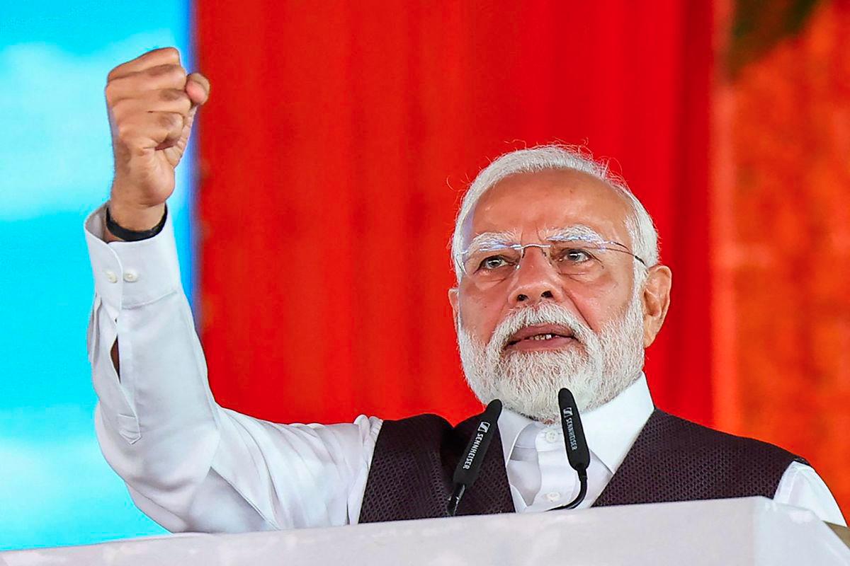 This photograph taken and released by the Indian Press Information Bureau (PIB) on June 6, 2025, shows India's Prime Minister Narendra Modi addressing the public during the inauguration of various projects at Katra in Jammu and Kashmir. - AFPPIX