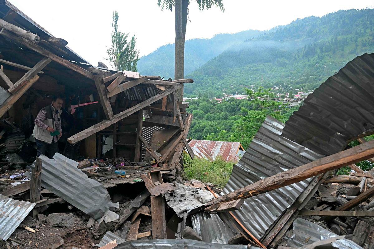 A local resident inspects the debris of his house that was destroyed by Pakistani artillery shelling at the Lagama village in Uri, about 100kms from Srinagar, on May 9, 2025. India and Pakistan accused each other on May 8 of carrying out waves of drone attacks, as deadly confrontations between the nuclear-armed foes drew global calls for calm. - AFPPIX