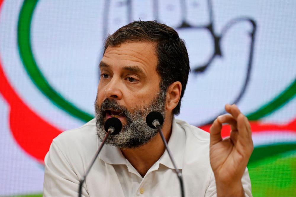 Congress party leader Rahul Gandhi gestures as he speaks during a press conference in New Delhi on March 25, 2023, after being disqualified as a member of parliament/AFPPix