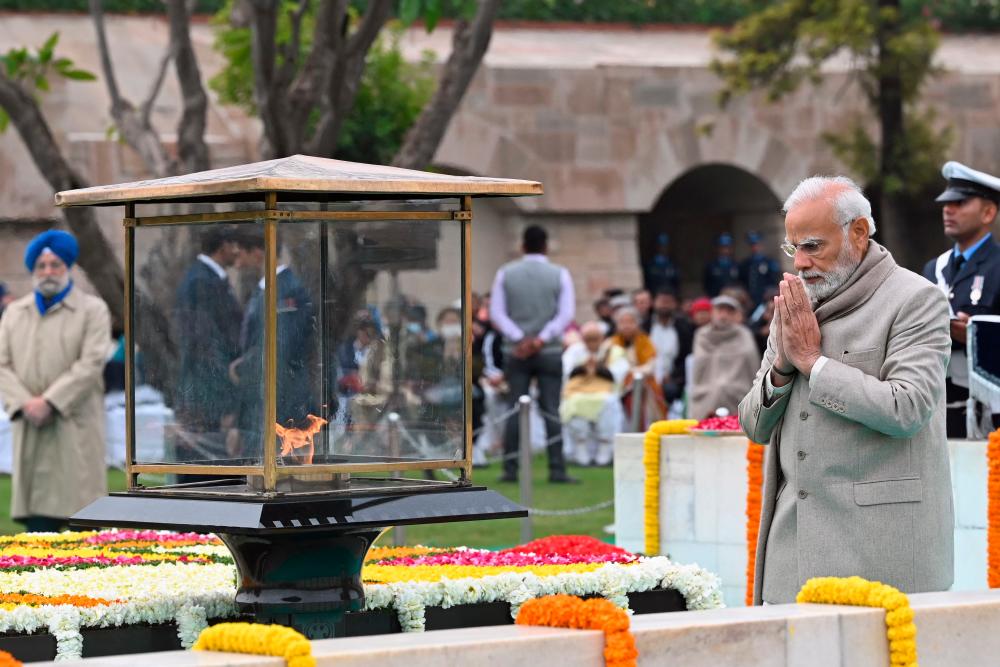 India’s Prime Minister Narendra Modi pays his respect at the Mahatma Gandhi memorial at Rajghat on Gandhi’s death anniversary in New Delhi on January 30, 2023/AFPPix