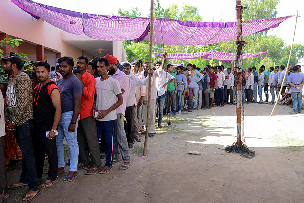 Indian voters queue to cast their votes at a polling station in a village on the outskirts of Amritsar on May 19, 2019, during the 7th and final phase of India’s general election. - AFP