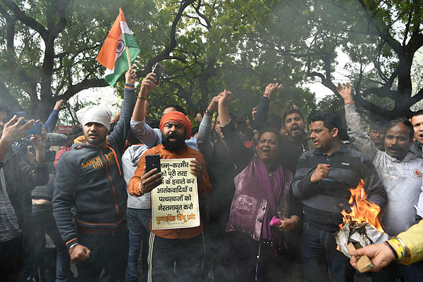 Activist of the Bajrang Dal and Vishwa Hindu Parishad (VHP) shout slogans against Pakistan during a protest in New Delhi — AFP