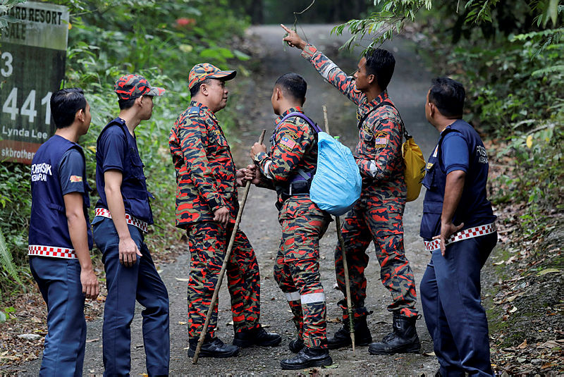 Officers from various search and rescue units gather to share information, as the search for missing 15-year-old Franco-Irish teenager Nora Anne Quoirin entered its sixth day, on Aug 9, 2019. — Reuters